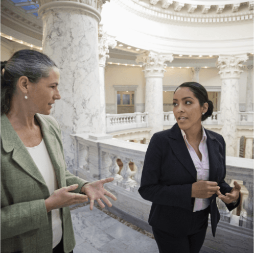 two professional women talking